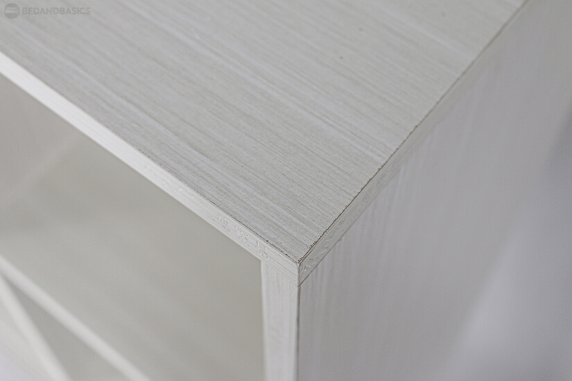 Lacquered in a light neutral wooden veneer. 