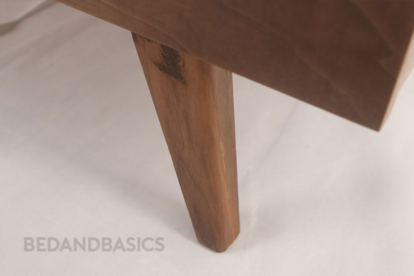The table is well-supported by its wooden legs to ensure sturdiness.