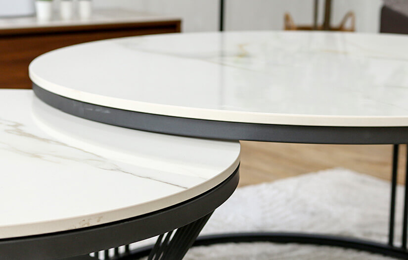  Dual tabletops. Push in the smaller coffee table to create extra room.