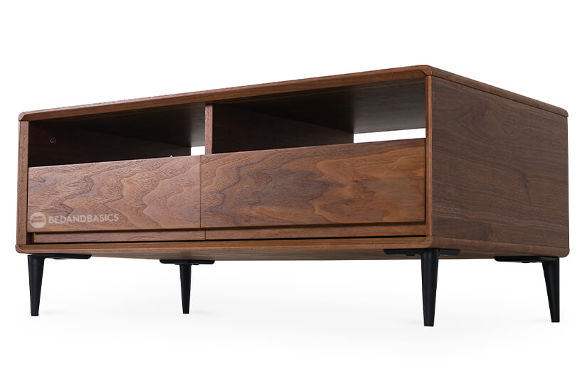 Featuring ample space, the coffee table comes with two shelves and two drawers.