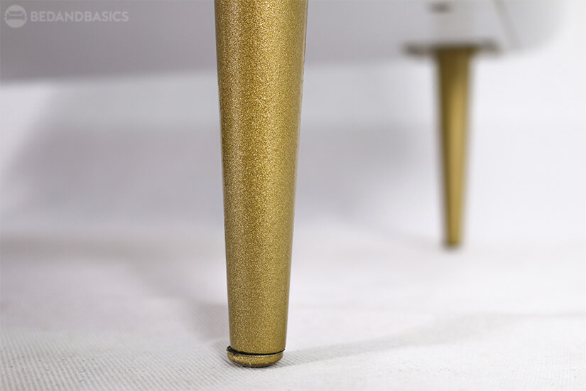 Sturdy metal legs with gold finish.