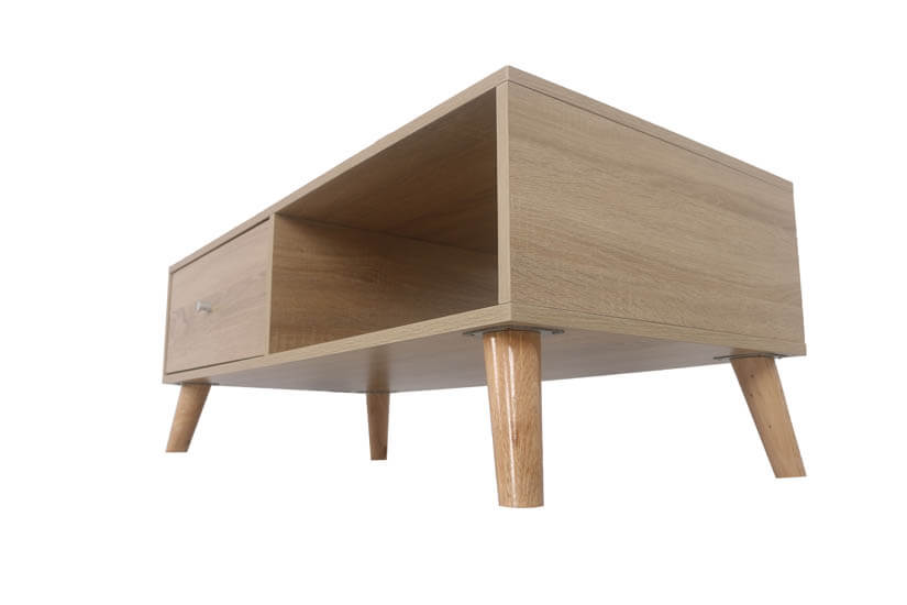 The coffee table is supported by round tapered solid wooden legs.