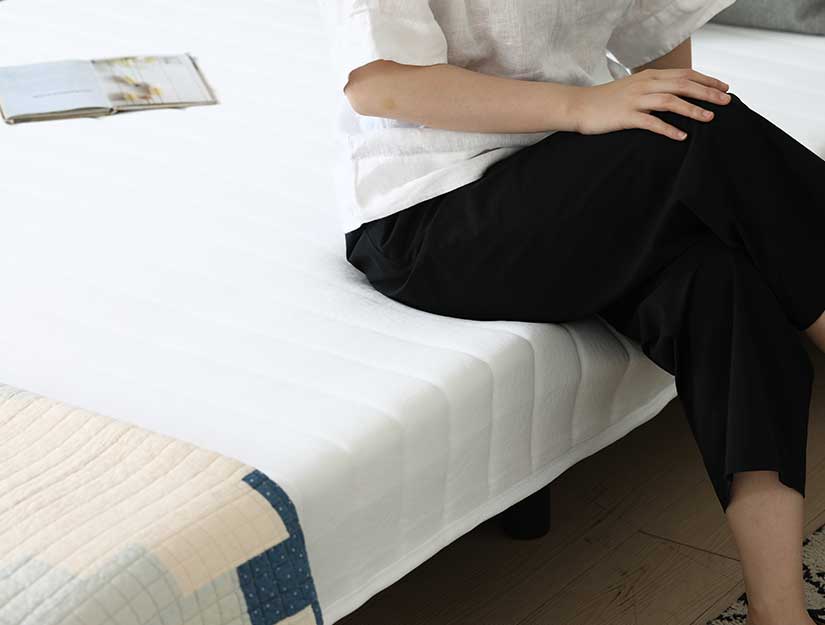Spring mattress distributes weight & pressure evenly.