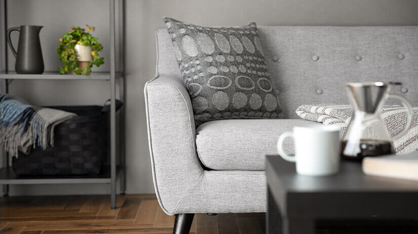 Fabric upholstery. Clean, straight edges. Straightforward design that fits many interior styles. 