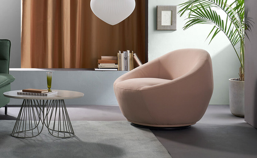 Large seat depth. Unique silhouette of rounded edges with sharp, angular edges towards its base. Armchair subtly rotates from top to bottom.