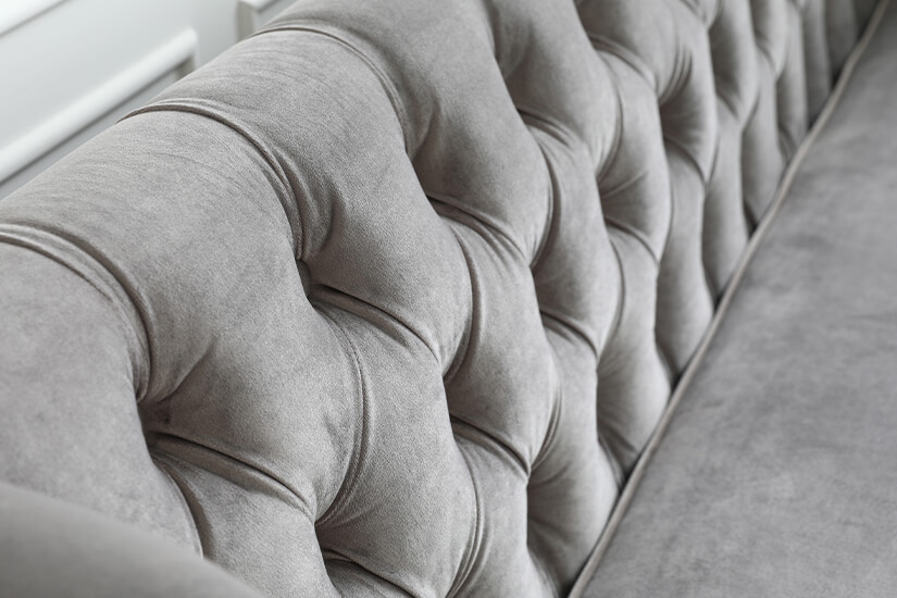 Backrests accented with button tufting. Classic design that is iconic to the Chesterfield Sofa design.