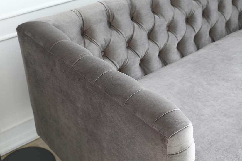 Grey velvet upholstery is soft and smooth to touch with a lustrous sheen.