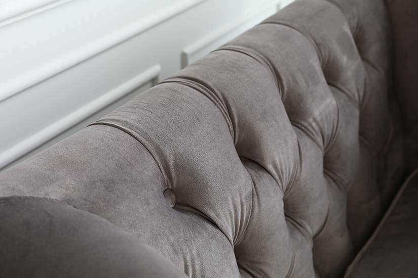 Backrests accented with button tufting. Classic design that is iconic to the Chesterfield Sofa design.