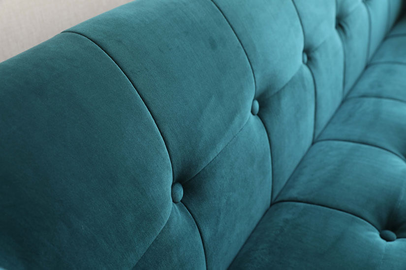 Button tuftings. Spread evenly across the sofa. A touch of mid-century flair.