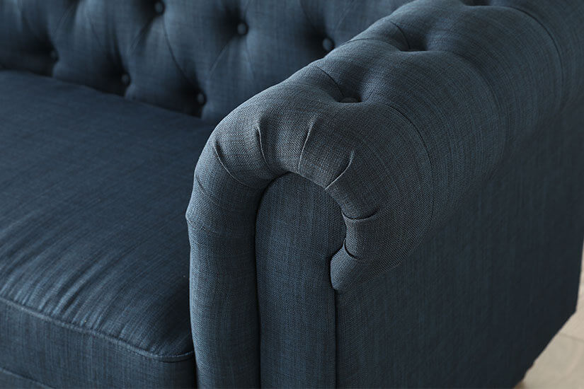 Rolled armrests. A distinct feature of a Chesterfield sofa design.