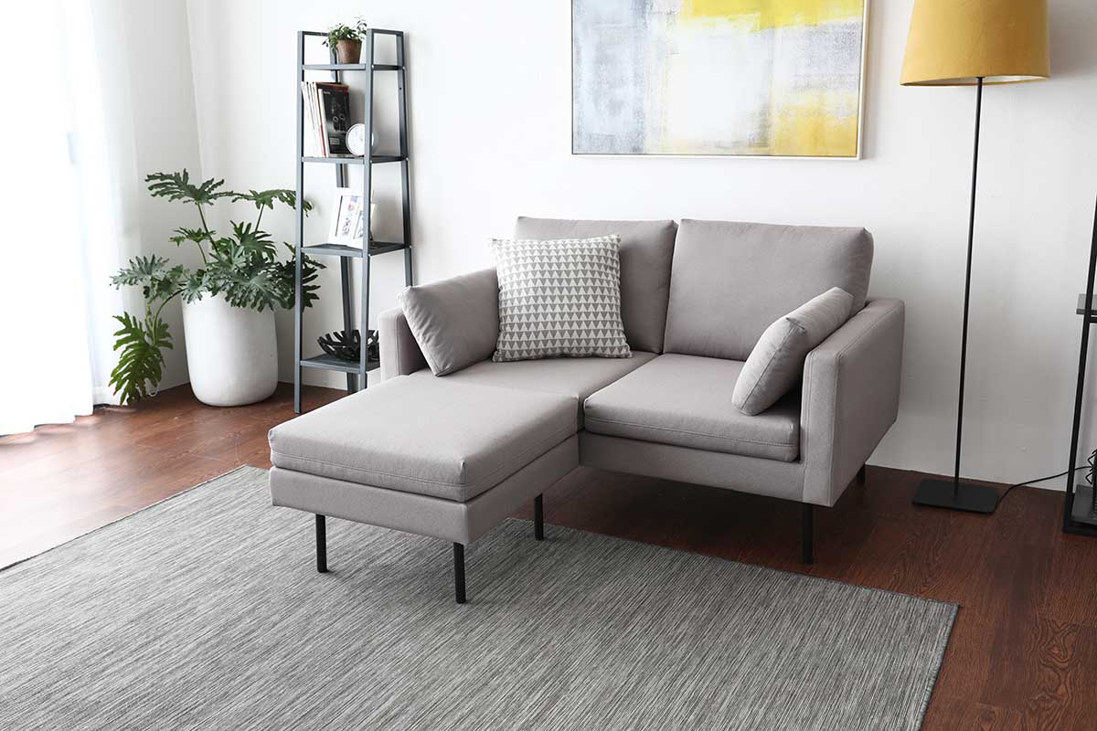 Create a lounge by purchasing an ottoman and connecting it to the sofa.