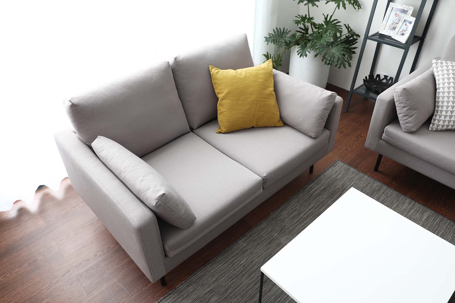 Side view of the Luna Sofa 3 seater sofa showcasing its ability to comfortably accommodate 3 seaters.