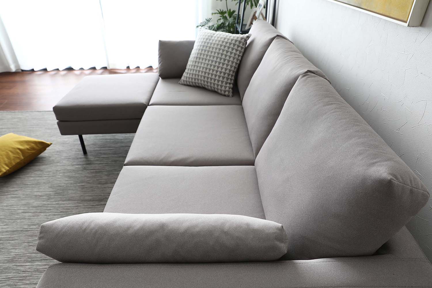 Side view of the Luna Sofa L-Shaped 3 seater sofa showcasing its ability to comfortably accommodate 3 seaters. 
