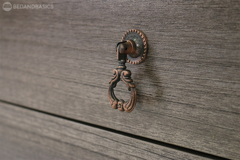 Intricately carved metal handle that adds a rustic touch.