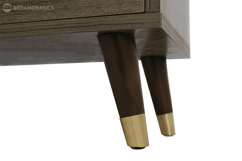 Supported by wooden legs. Embellished with golden tips.