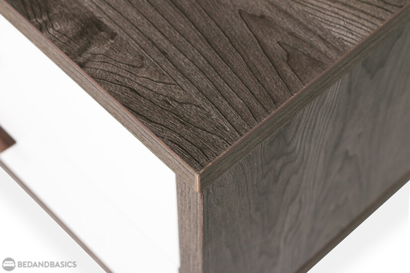 The dark ebony flat cut veneer shows off the beauty of the wood’s natural grain.