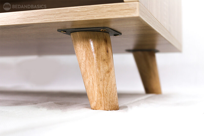 Supported by tapered solid wood legs. Sturdy & stable.
