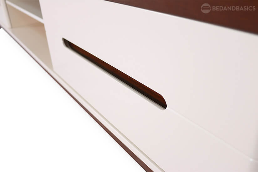 Recessed handles to allow smooth opening and closing of drawers.