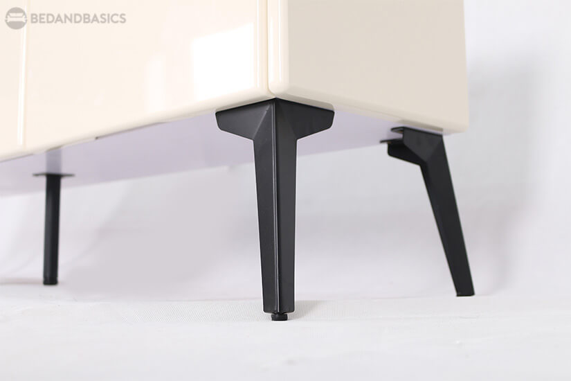 Sturdy metal legs that support the TV console with stability.