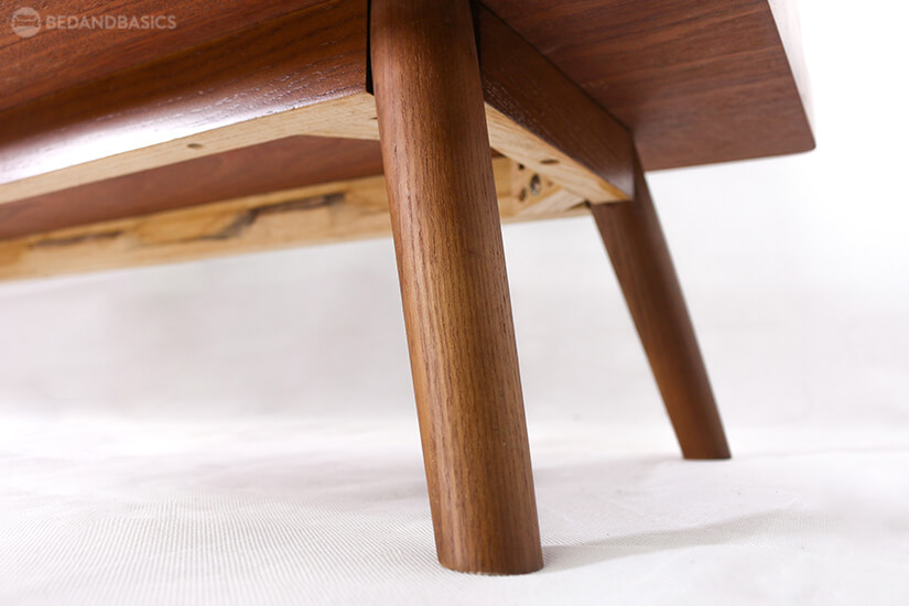 Supported by angled wooden legs. Stable & sturdy.