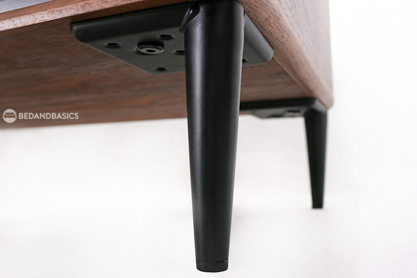 Supported by tapered metal legs. Sturdy & stable.