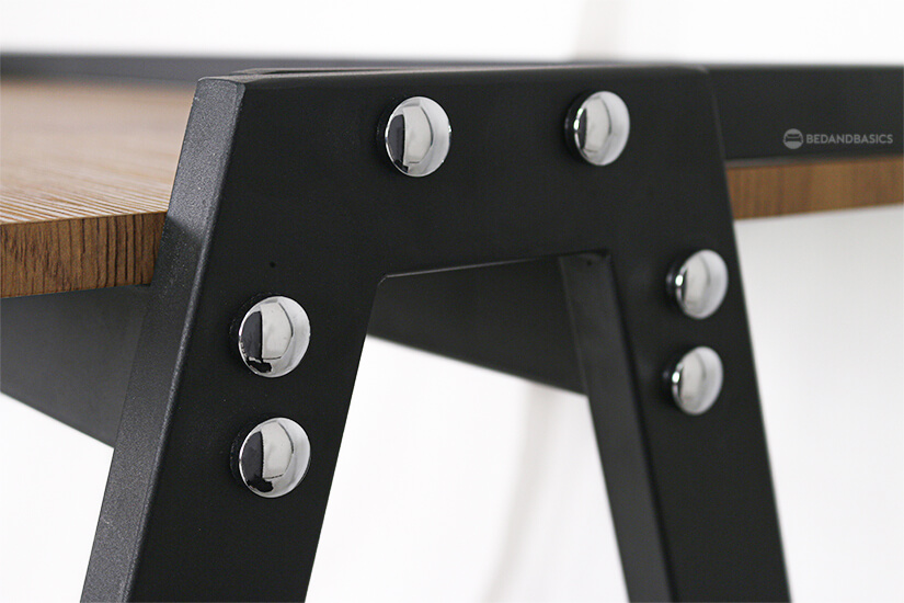 Silver round metal buttons elevates the look of the desk.