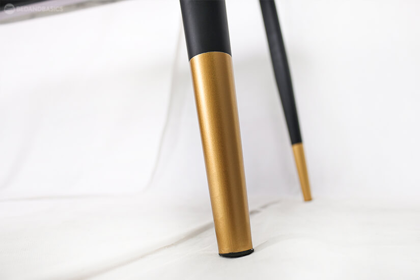 Gold-tipped legs provide a beautiful accent to the overall piece. 
