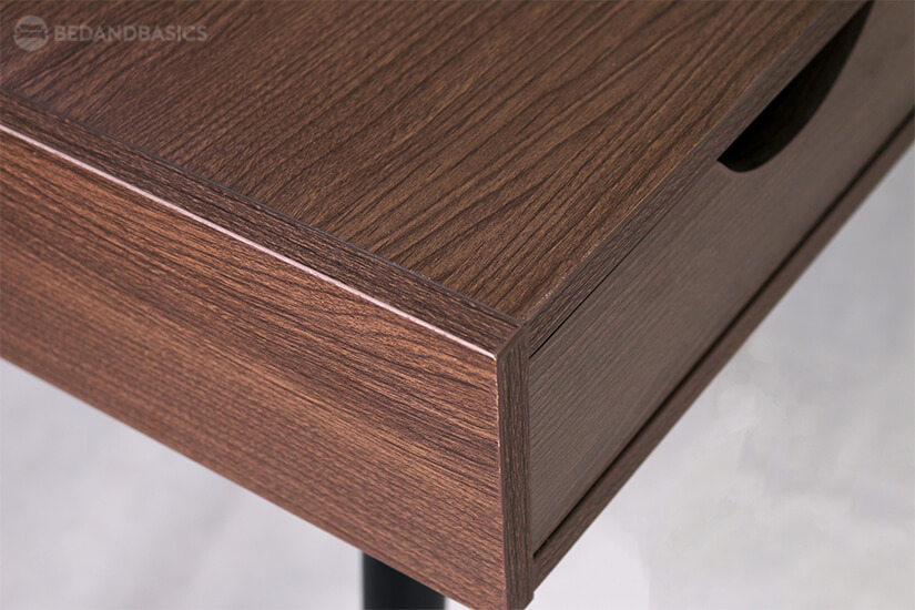 Laminated wood-swirl design adds a simple and natural detail to the study table.