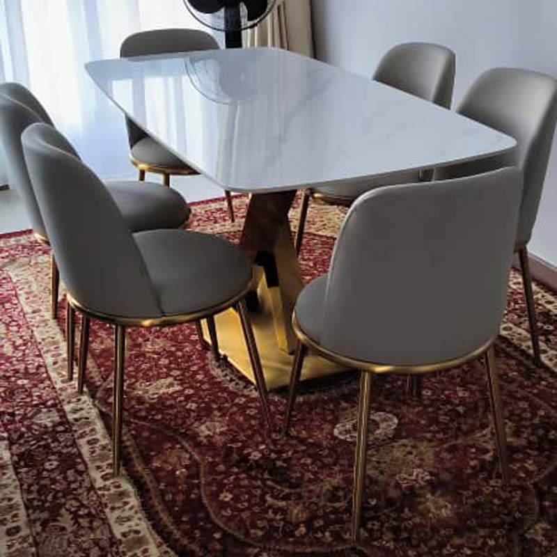 The Kyra Sintered Stone Dining Table (160cm, Gloss Snow mountain white) with Kyra dining chairs in off-white color.
