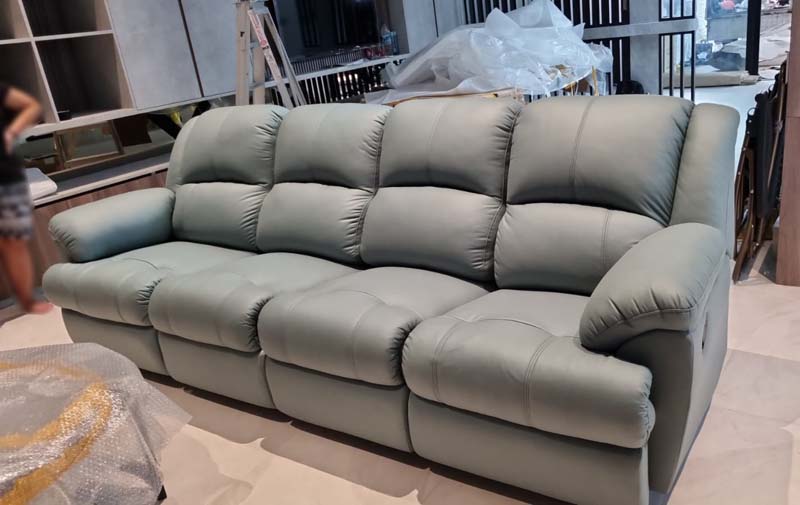 The Roosevelt Sofa in Jade color, specially customized to a 4 seater option.