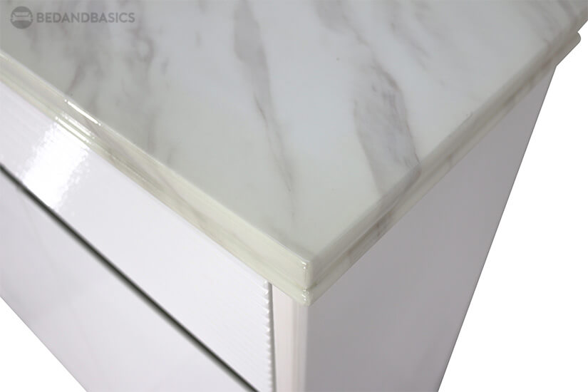 Cultured marble tabletop adds a luxurious feel to the shoe cabinet.