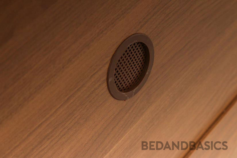 A non-intrusive hole is crafted in the cabinet to allow air to circulate in the cabinet.
 