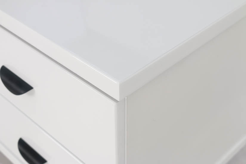 The side table has elegant black handles that are curved inwards to allow easy access to opening and closing.