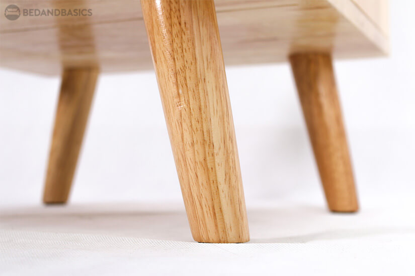 Supported with tapered solid wood legs.