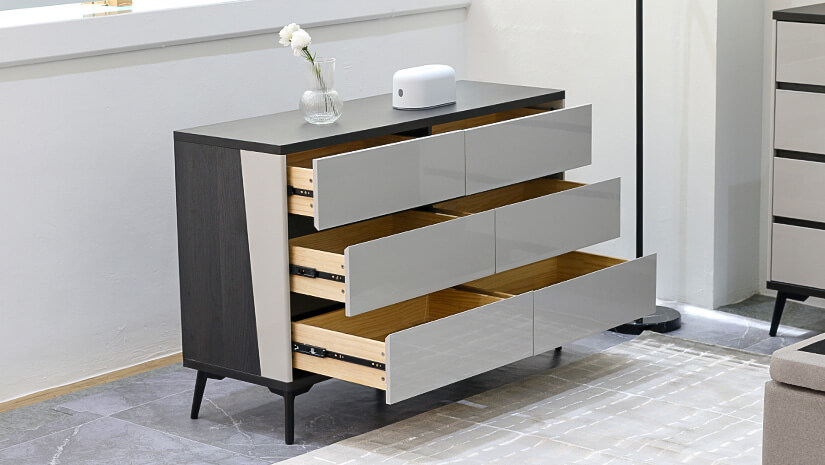 Dual tone design. Features 6 spacious, gloss-finish drawers.