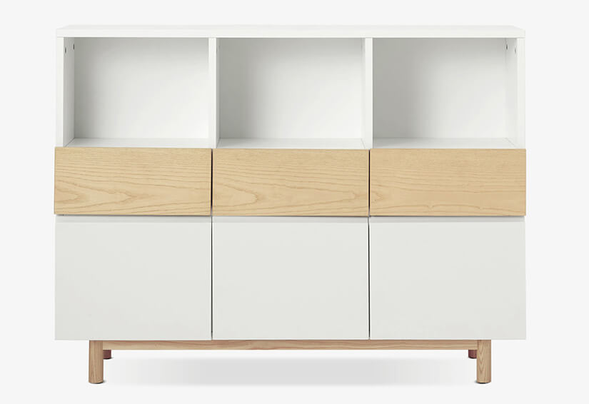 Cloud white panels create a blank canvas to cabinet design. Highlighting details that amplify beauty of the shelf. No handles. Seamless design. Gaps between each storage unit measured with precision. Creating lines that break the monotony of its design.