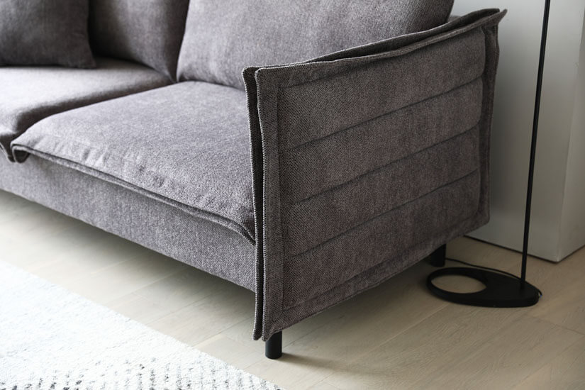 Textured fabric. Subtle colour shifts. Smooth to touch. 
Innovative design that sets itself apart from conventional sofas.