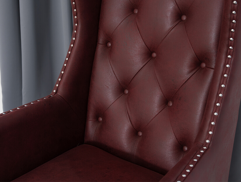 Backrest accented with exquisite diamond button tufting. 