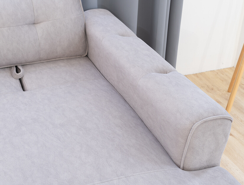 Cushioned armrests with tufting. Piped seams. Premium comfort.