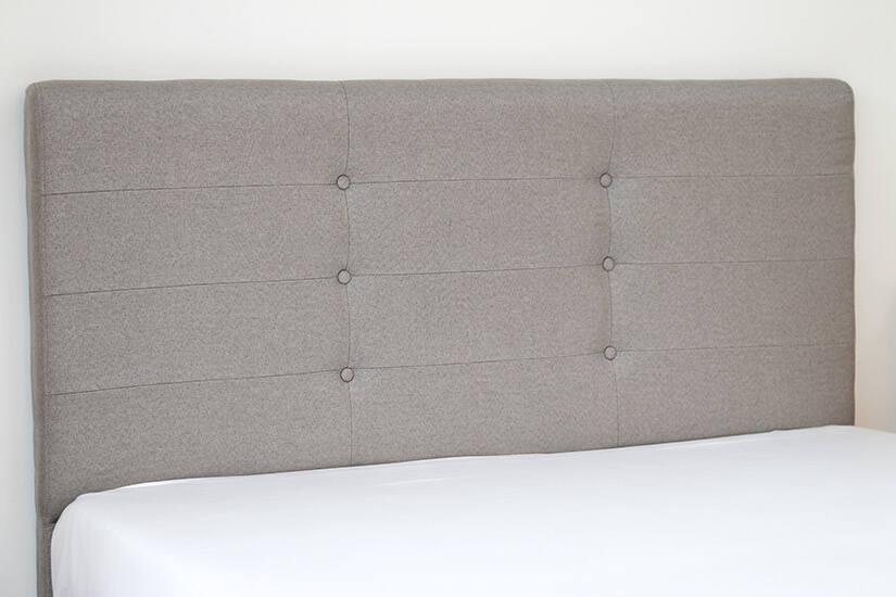 Classic handcrafted button-tufted headboard.
