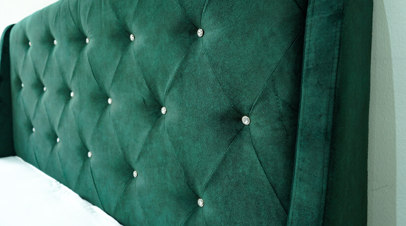 Tall plump headboard is tufted with sparkling faux crystals. Add a touch of light to your bedroom.  
