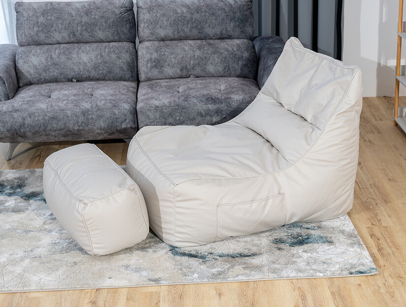 Comfy bean bag chair with ottoman. Versatile design.