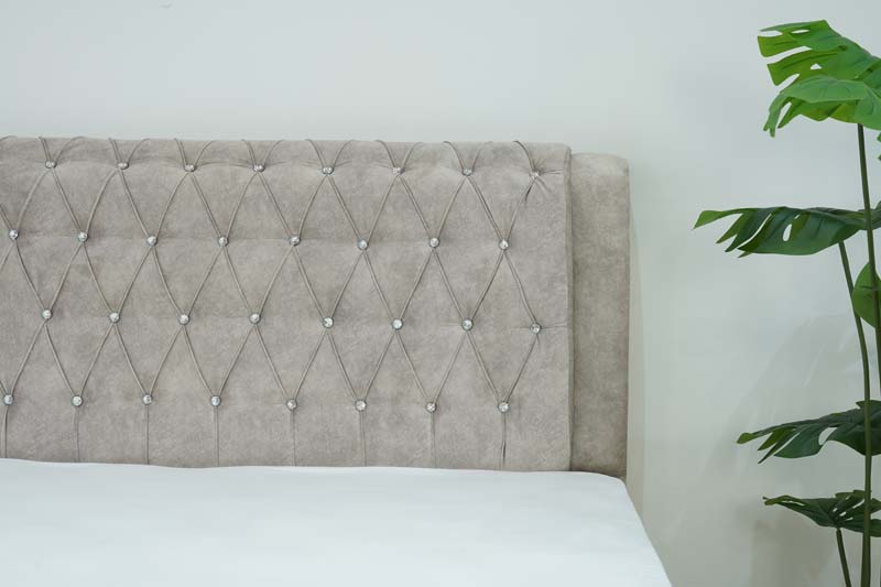 Foam cushioned headboard. Tufted with sparkling faux crystals and intricate piped seams. Add a touch of light to your bedroom.
