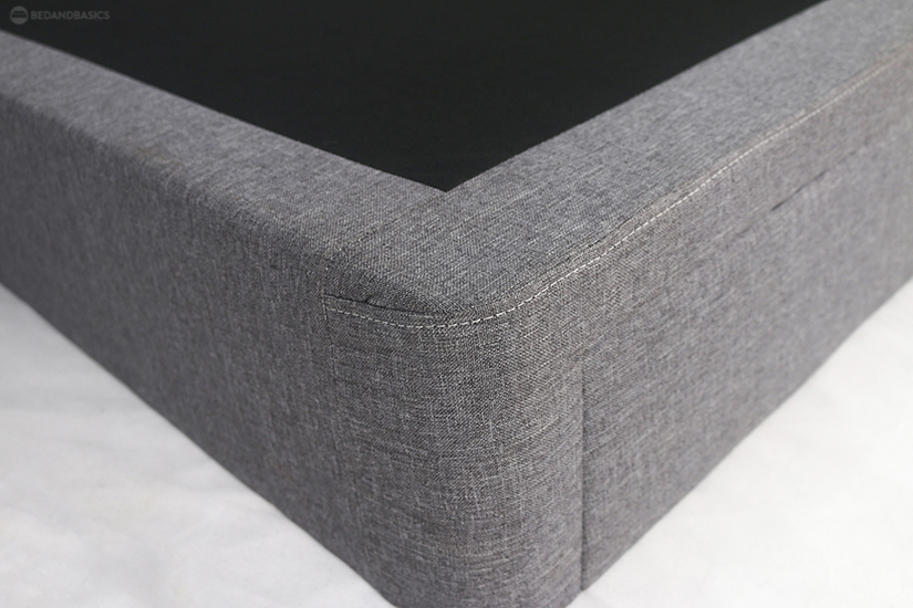 The mattress support base is made of plywood and wrapped in woven fabric.
